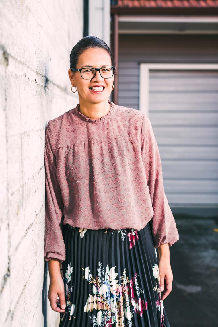 A woman smiling.